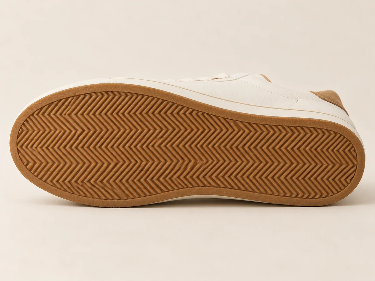 Full gum outsole view showing its herringbone pattern and perimeter