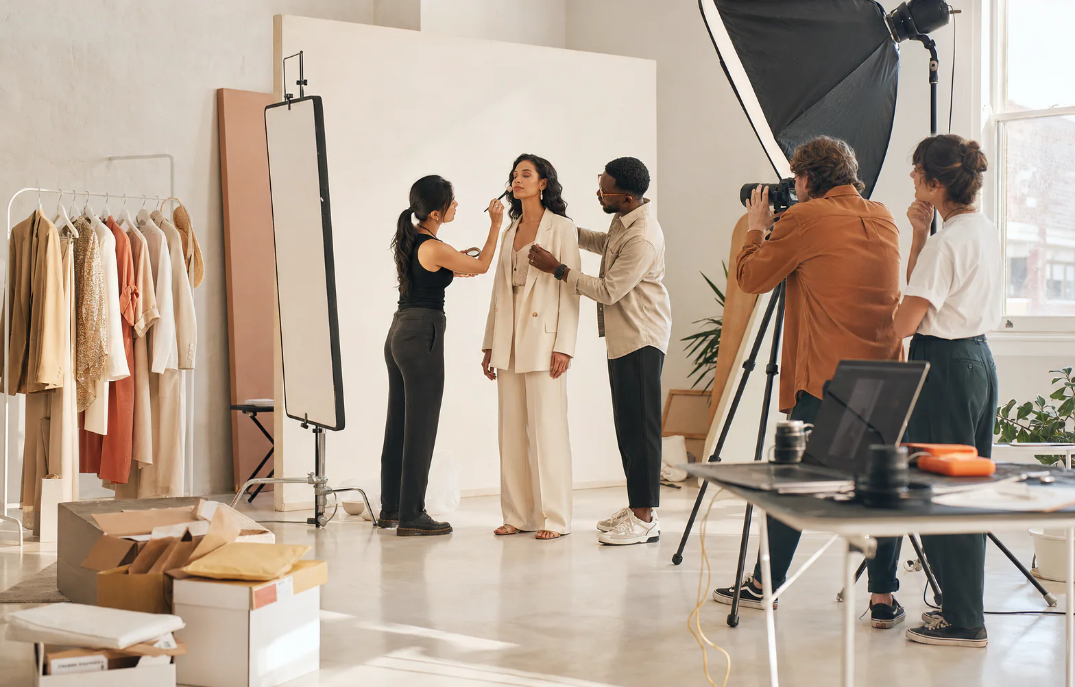 Traditional fashion shoot with a model and production crew
